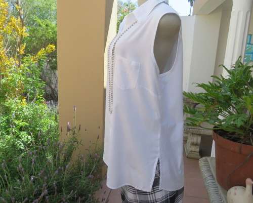 Snow white sleeveless summer top.Button down with shirt collar.By WOOLWORTHS size 38/14.As new.