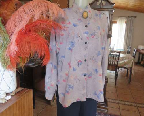 As new REFLEX USA long sleeve light brown with coral/blue pattern blouse.Silky polyester.Size 42