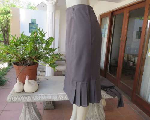 Light weight 2 pc smoke grey skirt suite.Long sleeve 1 button jacket/bandless skirt size 38.As new.