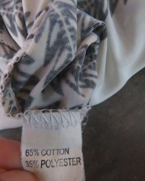 Cool white polycotton stretch knee length low V neck dress with black baroque print. Size 38/14.