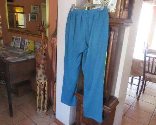 Men`s jade colour brushed polyester sport pants with yellow drawstring and leg edging.By MAXED in L.