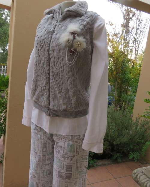 Warm,cozy silver grey fluffy polyester zip-up lined waistcoat.High neckline.Size 36 to 38.As new