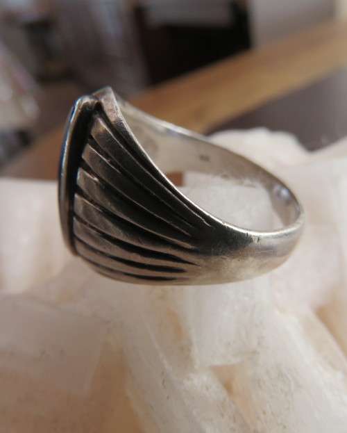 Handsome men`s 925 silver size 9.5 uniquely styled ring. With narrow black stone. New condition.