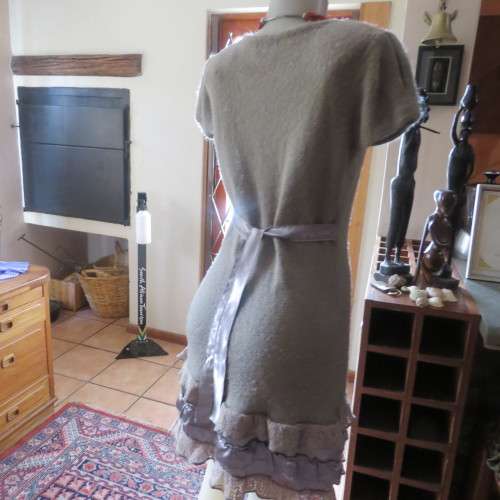 Unique ecru colour knitted dress in wool/poly and acrylic yarn.Scooped decorated neck.Size 36.As new