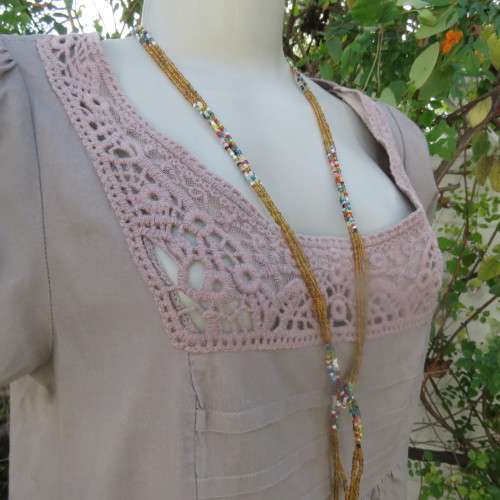 Chic loose ecru colour long top. Capped sleeves.Front lace decoration.Size 36