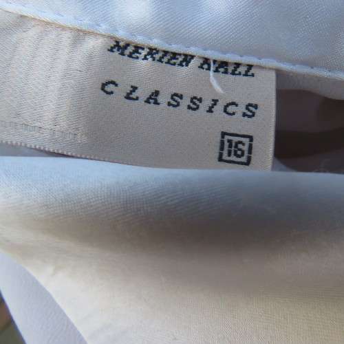 Smart long sleeve off-white top. Button down with satin covered buttons/shirt collar.Size 40. M.H.