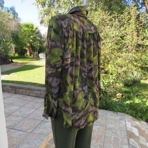 Impressive wide cut size 36/12 long sleeve top patterned in browns/greens. Gathered yokes.As new.