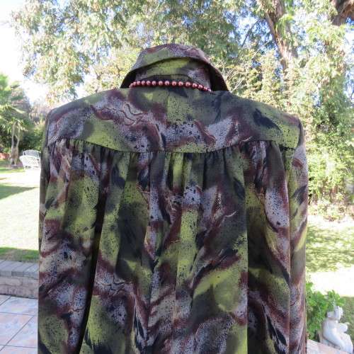 Impressive wide cut size 36/12 long sleeve top patterned in browns/greens. Gathered yokes.As new.