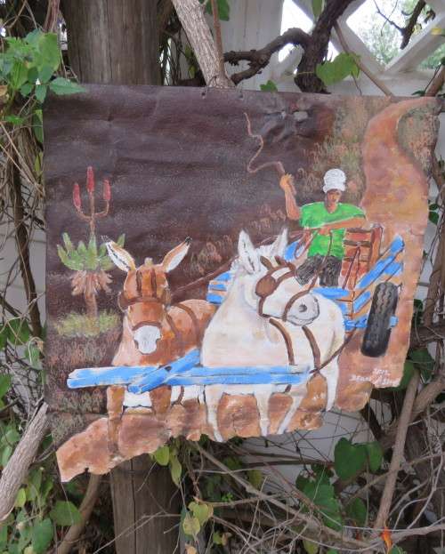 Unique decorative junk art by artist DEON ASSUR 2012 of donkey cart/donkeys on rusted metal.
