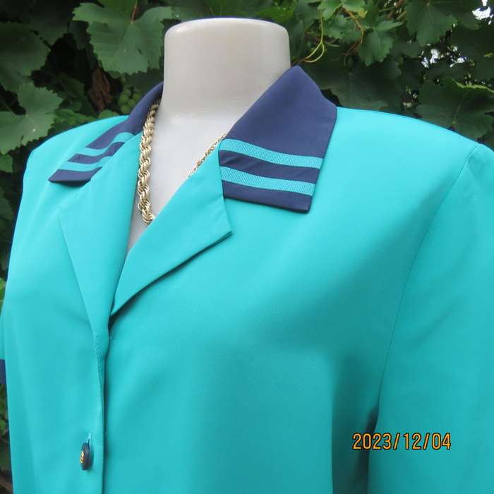 Beautiful jade silky polyester short sleeve top with navy open collar. By WOOLWORTHS size 38. As new