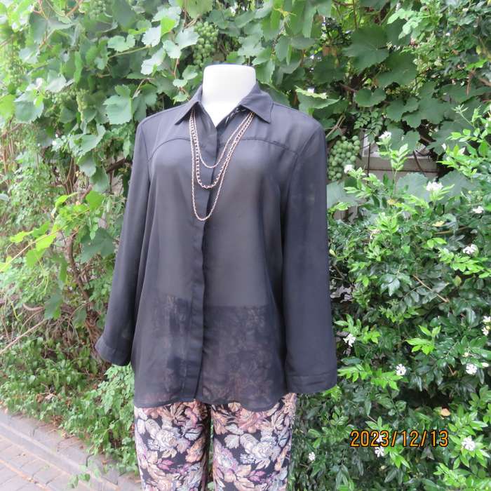Fabulous sheer black long sleeve top with hidden button down/shirt collar. Size 38 by IMAGE. As new