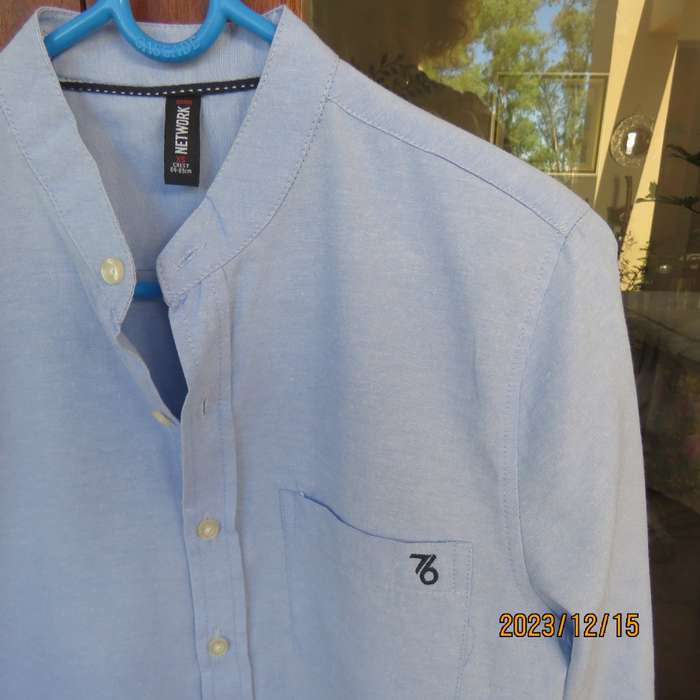 Brand new men`s sky blue long sleeve/high collar polycotton shirt size XS by NETWORK. Chest 84 -89cm