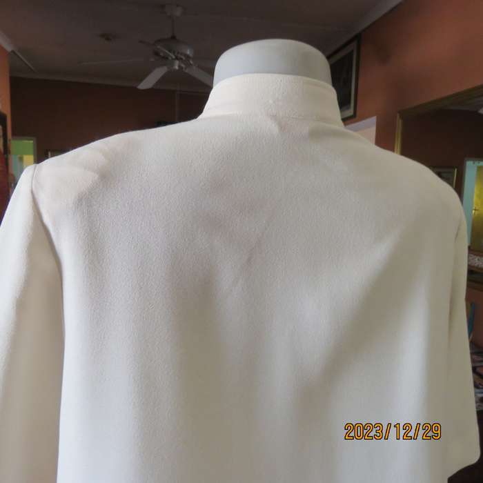 Ultra smart rich cream IBERIS size 38 long top double front. Poly-viscose.High neck. As new