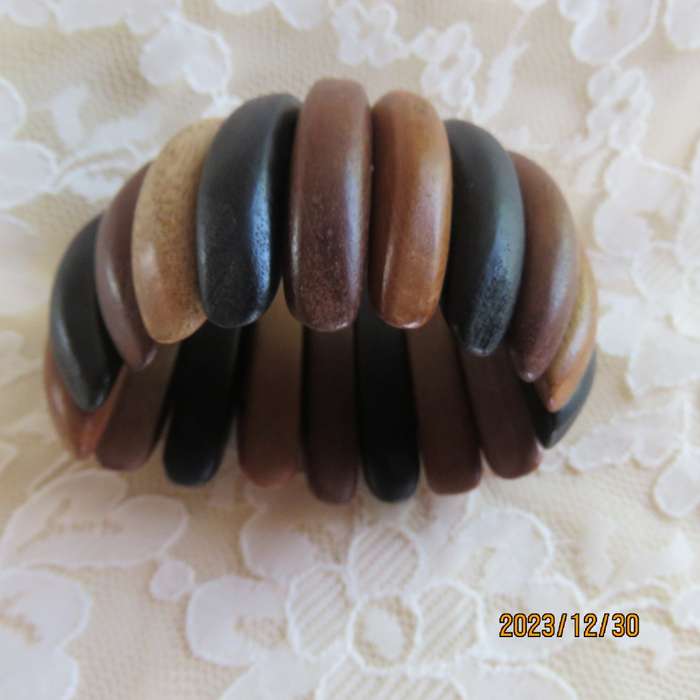 Stunning wooden stretch bracelet made up of different woods. Width 5cm. New condition.
