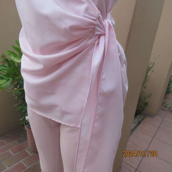 As new coral peach sleeveless cross over top with ties at side. Collar. Stretch polycotton.Size 42