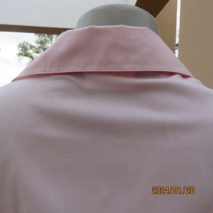 As new coral peach sleeveless cross over top with ties at side. Collar. Stretch polycotton.Size 42