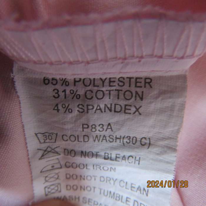 As new coral peach sleeveless cross over top with ties at side. Collar. Stretch polycotton.Size 42