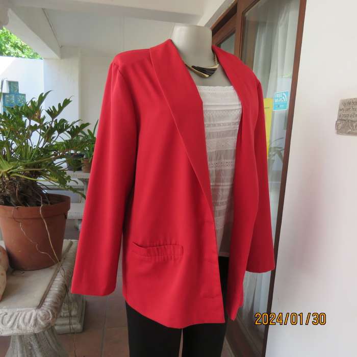Get noticed in this carmine red long sleeve 3 button jacket with shawl collar.Size 38 to 40. As new