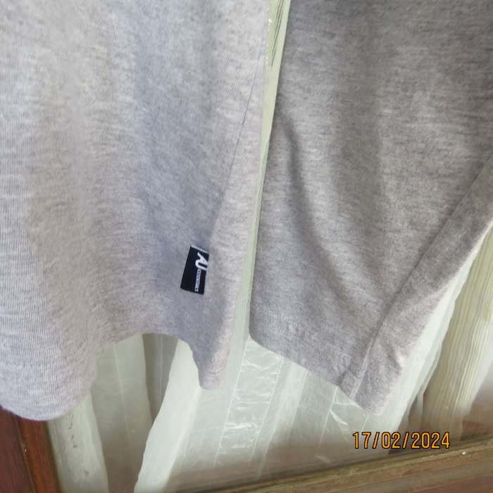 As new Men`s grey long sleeve T-Shirt in 100% cotton.Opening on front with 3 buttons. By AU. 87/94cm