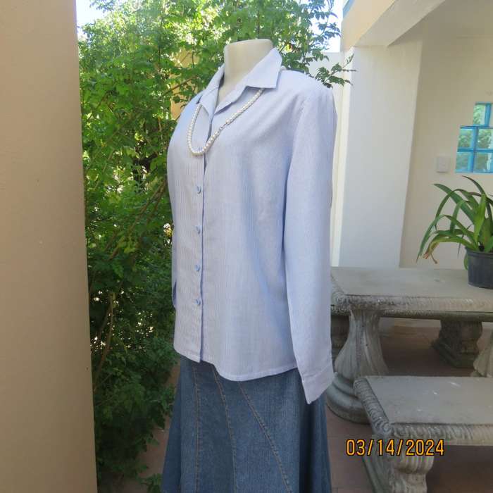 Casual long sleeve cotton blue/white striped button down shirt with collar. Size 40. No label.As new