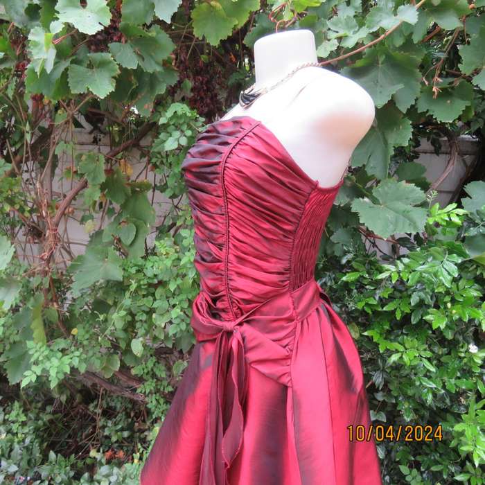 Chic garnet red polyester satin dress. Ruched top front. Skater skirt. Size 36.