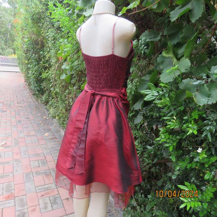 Chic garnet red polyester satin dress. Ruched top front. Skater skirt. Size 36.