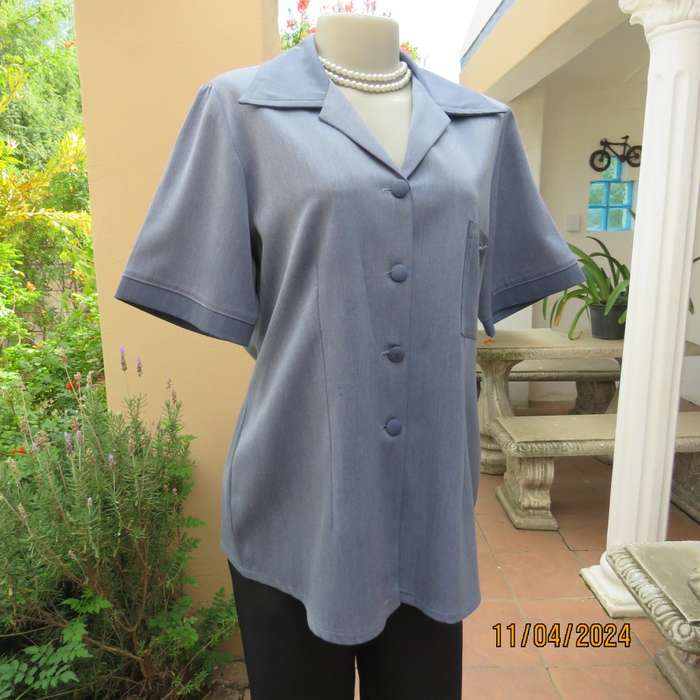 Boutique made short sleeve button down top in blues Polyester-viscose. Size 38.