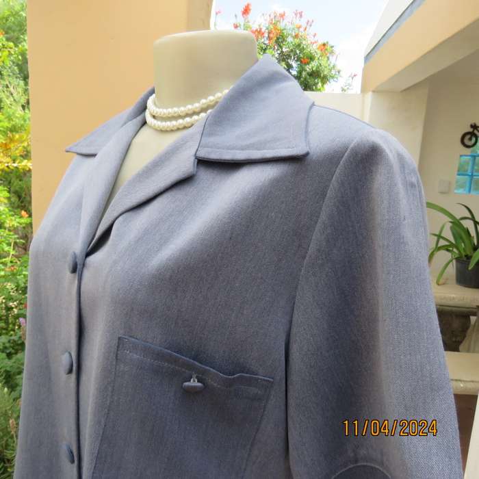 Boutique made short sleeve button down top in blues Polyester-viscose. Size 38.
