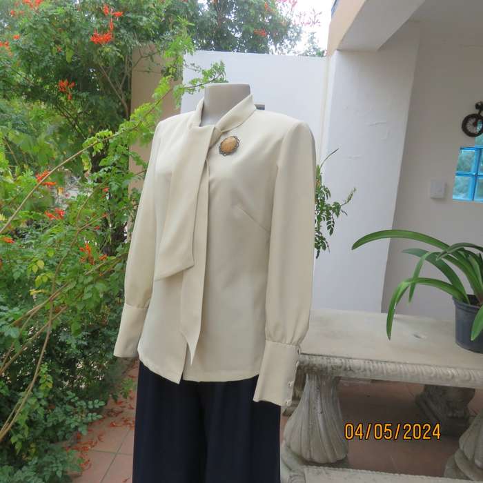 Smart rich cream 100% firm polyester long sleeve top/ Tie collar/Covered front buttons. Size 36.