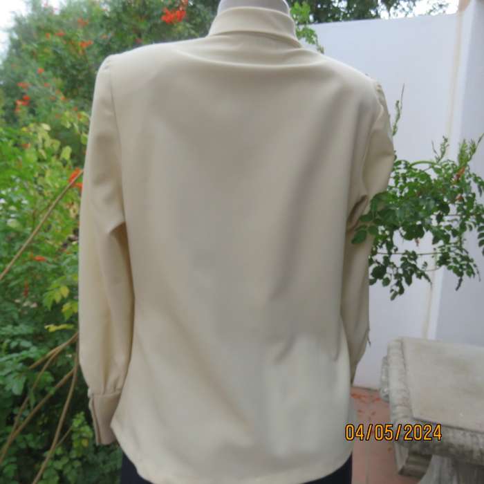 Smart rich cream 100% firm polyester long sleeve top/ Tie collar/Covered front buttons. Size 36.