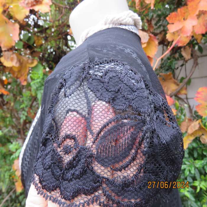 Handy crossover sheer polyester black bolero. Long straps to tie, Tiny lace capped sleeves. Size 38