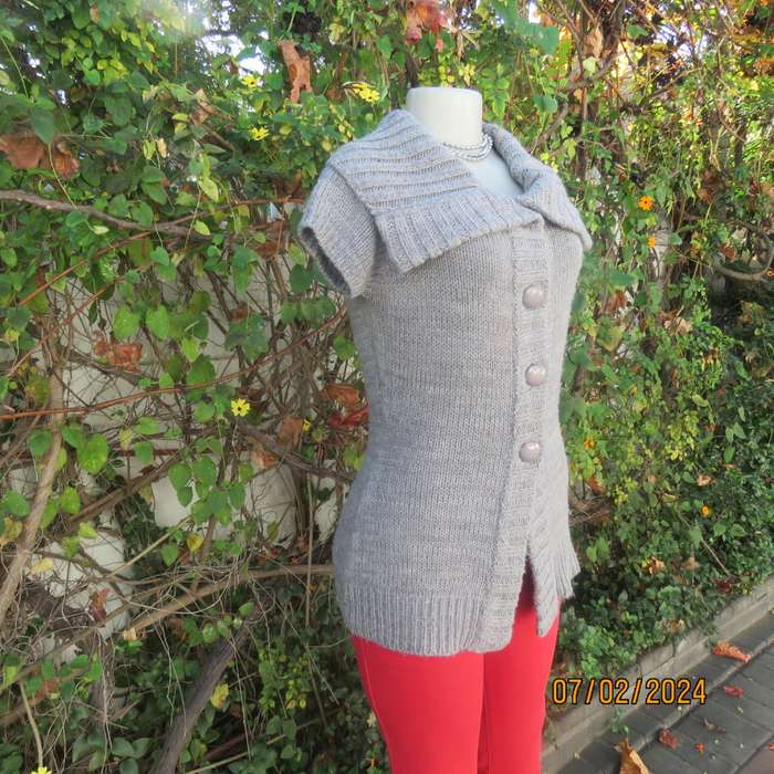 Double knit grey acrylic cardigan. Capped sleeves, button down. Wide fold over collar. Size 36.
