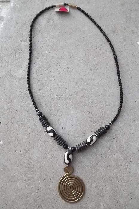 Black and White Choker with Brass Pendant . Wide enough to fit all. Pendant can be replaced.