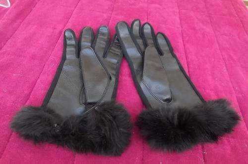As new black leather gloves in Medium with faux fur trimming.