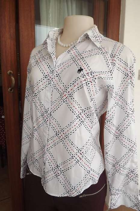 Beautiful ladies Polo Softwear shirt.Styled with navy&red broken line pattern.Size 34/10.