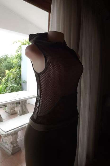 Pretty military green polyester mesh sleeveless op with kangaroo pocket.Size 34/0 by Free Clothing.