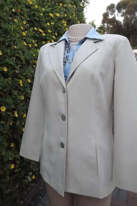 Very smart light beige Topics tailored jacket in 100% polyester.Size 34/10.Fully lined.As new.