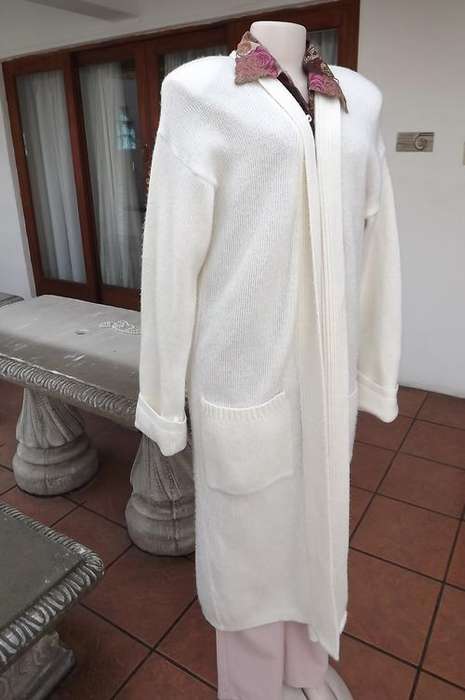 Cream acrylic knitted long coat.Loose hanging.Best fit size 42/18.Extra long fold over cuffs sleeves