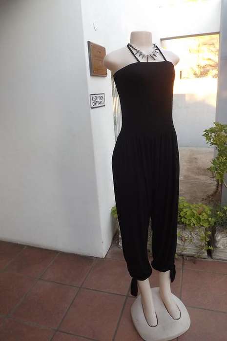Sexy black stretch cotton shoulderless jumpsuit with harem pants size 38/14.Elasticated top.Legs fas