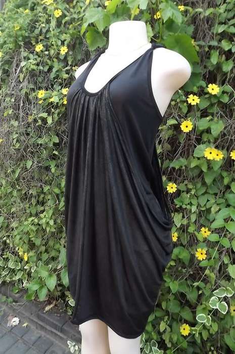 Black fashionable short dress with flowing overlay and gold glitter surface.Size 36/12.