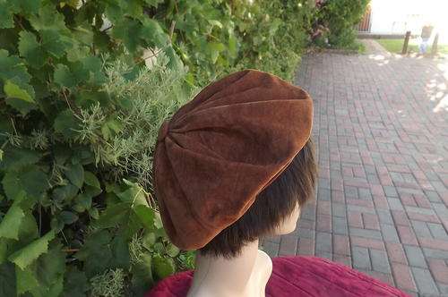 Tan colour Suede look hat.Pretty and versatile.Used but in good condition.