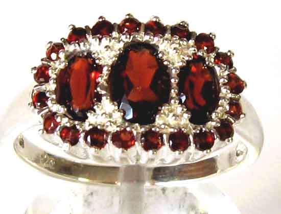 Excellent Sterling Silver and genuine Garnets Ring.