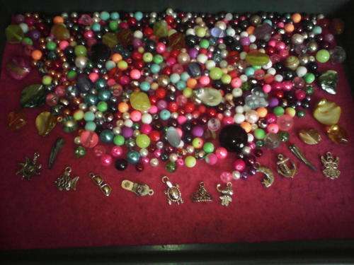 500 glass beads plus 30 fancy beads and shell beads,10 charms