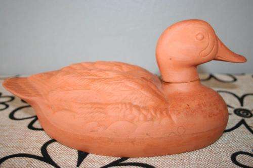 A gorgeous pair of terracotta stoneware ornamental ducks - perfect for the garden or pond