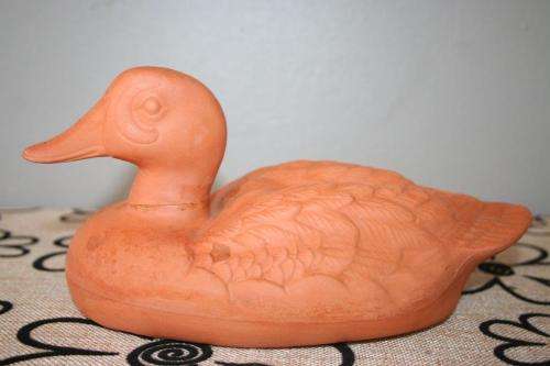 A gorgeous pair of terracotta stoneware ornamental ducks - perfect for the garden or pond