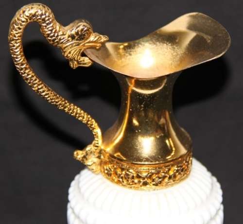 An extremely rare French ''opaline trianon'' milk glass jug with gold plated embellishments