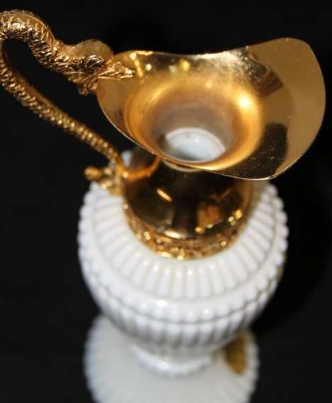 An extremely rare French ''opaline trianon'' milk glass jug with gold plated embellishments