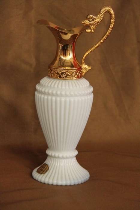 An extremely rare French ''opaline trianon'' milk glass jug with gold plated embellishments