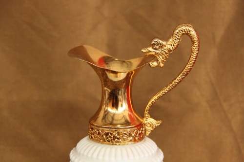 An extremely rare French ''opaline trianon'' milk glass jug with gold plated embellishments