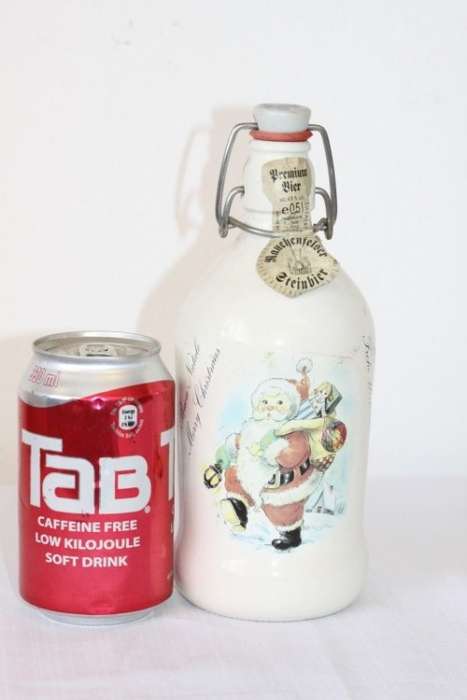 An awesome vintage German "Rauchenfelser Steinbier" porcelain Xmas commemorative flip-top decanter